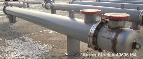 Unused- Mueller Shell and Tube Heat Exchanger, 341 square feet, horizontal. Carbon steel shell rated 150 psi at 200 deg F and -20 deg F at 150 psi. (109) 3/4" diameter x 16' long 304 stainless steel ...
