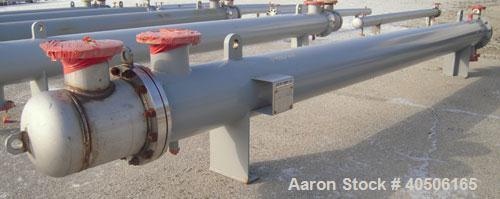 Unused- Mueller Shell and Tube Heat Exchanger, 341 square feet, horizontal. Carbon steel shell rated 150 psi at 200 deg F and -20 deg F at 150 psi. (109) 3/4" diameter x 16' long 304 stainless steel ...