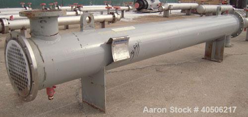 Used Mueller Shell and Tube Heat Exchanger, 235 square feet, horizontal. Carbon steel shell rated 150 psi at 200 deg   F and -20 deg F at 150 psi. (109) 3/4" diameter x 11' long 304 stainless steel t...