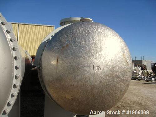 Unused- Heat Transfer Systems Single Pass Shell and Tube Heat Exchanger, 10259 square feet, horizontal, type AEM 71-216. Carbon steel shell rated FV/150 psi at -20 to 200 deg F. (1785) 1-1/4'' diamet...