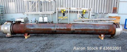Used Perry Products Multiple Pass Shell & Tube Heat Exchanger, 1905 Square Feet, Horizontal. Carbon steel shell rated 150 psi at 20 to 370 degrees F. (486) 3/4" diameter x 20' long 316L stainless ste...