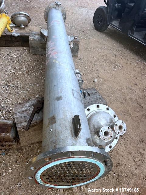 Used Perry Products 225 sq. ft. Vertical Shell and Tube Heat Exchanger. 304L Stainless steel tubes rated 75 psi at 0 to 320 degrees F, 11' Tube length, 104 tube holes. 1' Shell diameter. Stainless st...
