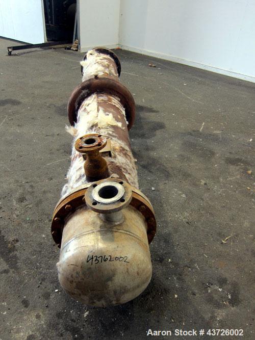 Used Rubicon Industries Multiple Pass Shell & Tube Heat Exchanger, 324 Square Feet, Model SC16B4-108HE, Horizontal. Carbon steel shell rated 150 psi at -20 to 400 degrees F. (184) 3/4" diameter x 108...