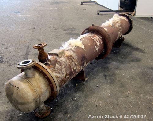 Used Rubicon Industries Multiple Pass Shell & Tube Heat Exchanger, 324 Square Feet, Model SC16B4-108HE, Horizontal. Carbon steel shell rated 150 psi at -20 to 400 degrees F. (184) 3/4" diameter x 108...
