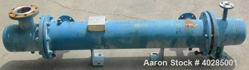 Used Rubicon shell and tube heat exchanger, model VT8A1-48H, 48 square feet, horizontal. Carbon steel shell rated 150 psi at 400 deg F. (73) 9/16" diameter x 48" long, 316L stainless steel, tubes rat...