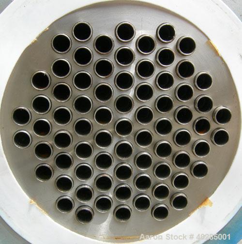 Used Rubicon shell and tube heat exchanger, model VT8A1-48H, 48 square feet, horizontal. Carbon steel shell rated 150 psi at 400 deg F. (73) 9/16" diameter x 48" long, 316L stainless steel, tubes rat...