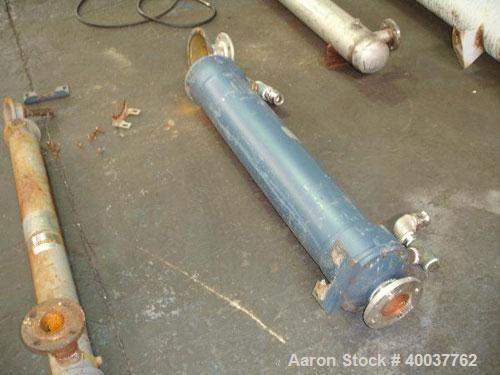 Used- ITT Shell and Tube Heat Exchanger, 82 Sq. Ft. , 316 stainless steel tubes, tube sheets, bonnets and shell with (210) 3...