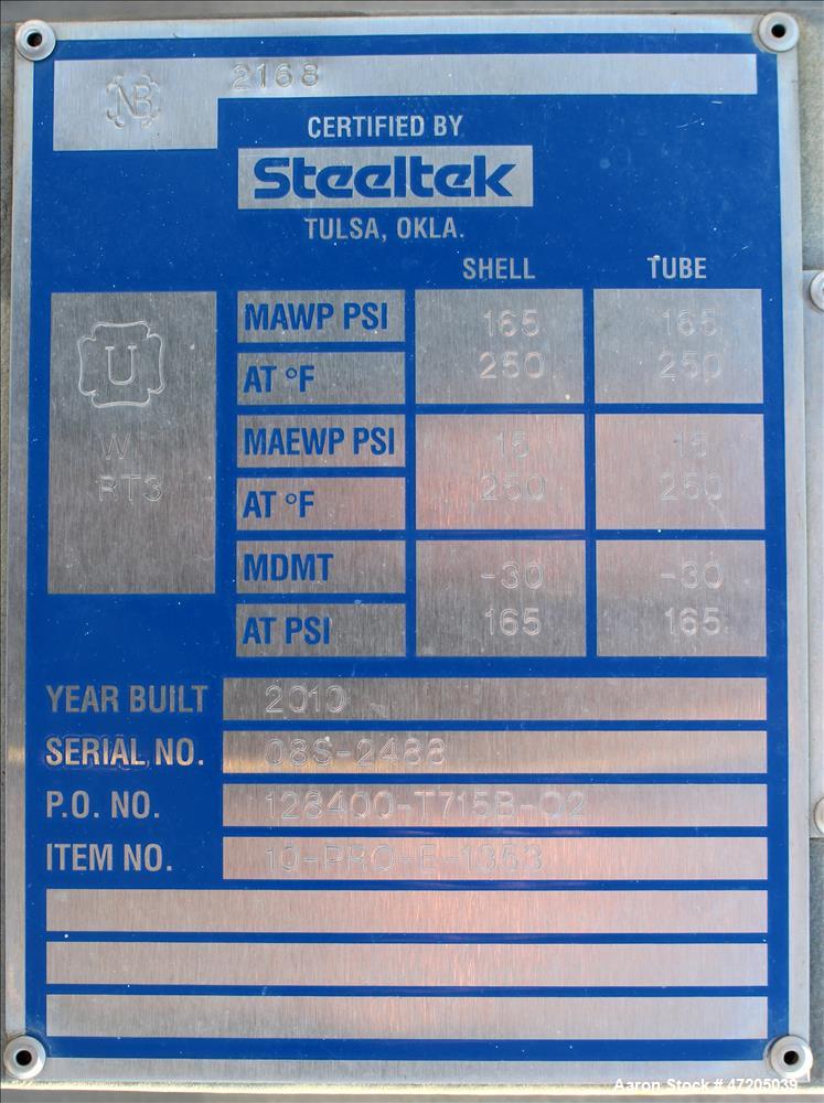 Unused- Steeltek 2 Pass Shell & Tube Heat Exchanger, 496 Square Feet, Type BEM, Size 23-9, Vertical. 304L Stainless Steel shell rated 165 psi at -30 to 250 degrees F. (262) 1" Diameter x 8' long 304L...