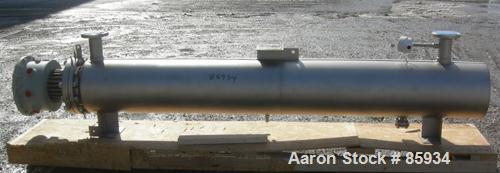 Unused- Watlow Shell and Tube Heat Exchanger, 63.5 Square Feet, Horizontal. Rated 100 PSI at 400 Degrees F. 310 stainless steel tubes.  3" inlet/outlet. Includes an electric heater control panel, 210...