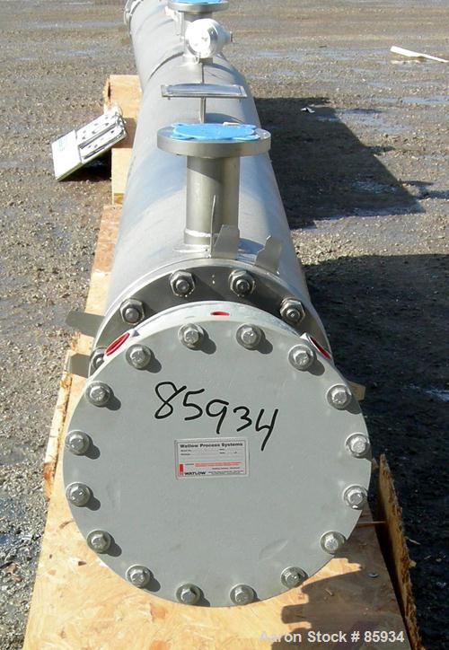 Unused- Watlow Shell and Tube Heat Exchanger, 63.5 Square Feet, Horizontal. Rated 100 PSI at 400 Degrees F. 310 stainless steel tubes.  3" inlet/outlet. Includes an electric heater control panel, 210...