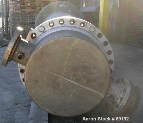 USED: Wayron Inc multi pass shell and tube heat exchanger, 706 square feet, horizontal. Carbon steel shell with expansion ring rated 150 psi at 370 deg F. (180) 1-1/4" diameter x 12' long Duplex 2205...