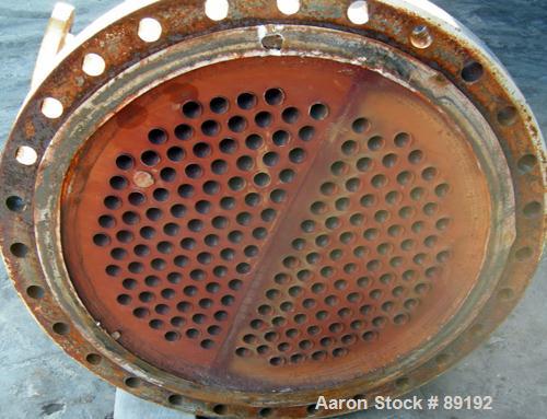 USED: Wayron Inc multi pass shell and tube heat exchanger, 706 square feet, horizontal. Carbon steel shell with expansion ring rated 150 psi at 370 deg F. (180) 1-1/4" diameter x 12' long Duplex 2205...