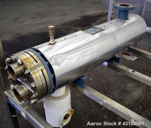 Used Yula Corporation U Tube Heat Exchanger, approximately 16 square feet, horizontal, model CV-2C-39BS. Carbon steel shell rated 150 psi at 300 degrees F. (13) 3/4 diameter x 39" long 316L stainless...