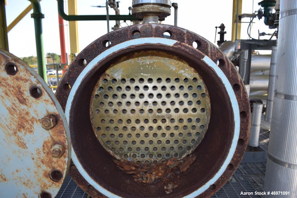 Used Yula 2 Pass Shell & Tube Heat Exchanger, 302 Square Feet, Model WC-2H-144BS, 304L Stainless Steel, Horizontal. 304L Stainless steel shell rated 75 psi at 40 to 250 degrees F. (130) 3/4” diameter...