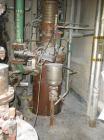 Used Heat Exchanger, Approximately 200 sqft, Vertical, Stainless steel tubes and heads.  Carbon steel shell.   Shell measures: 16