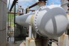 Used-Heat Exchanger, 4280 Square Feet, 4 pass shell and tube, horizontal.  Carbon steel shell rated 75 psi at 300 deg F.  (1...