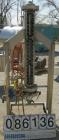 USED: Heat exchanger, approximately 31 square feet, 316 stainless steel, vertical. (88) 3/8