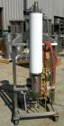 USED: Heat exchanger, approximately 31 square feet, 316 stainless steel, vertical. (88) 3/8