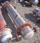 Used Shell And Tube Heat Exchanger, approximately 88 square feet. Stainless steel shell rated 60 psi, (90) 3/4