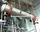 Used Shell And Tube Heat Exchanger, approximately 88 square feet. Stainless steel shell rated 60 psi, (90) 3/4