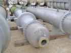 Unused- Atlas Industrial Single Pass Shell and Tube Heat Exchanger, 1274 square feet, vertical, type BEM 26-144. Carbon steel shell rated FV/150 psi at -20 to 400 deg F. (552) 3/4