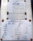 Used Atlas Industrial Shell and Tube Heat Exchanger, 43 square feet, vertical. Carbon steel shell rated full vaccum and 150 psi at 450 deg F, (55) 3/4