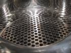 Used Atlas Heat shell and tube exchanger, 403 square feet. 316L stainless steel tubes, tube sheets, shell and bonnets, with (257) .75