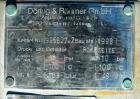 Used Doring & Baumer Six Pass Shell and Tube Heat Exchanger, 157 square feet, horizontal. 304 stainless steel shell rated 6 bar (87 psi) at 100 deg C (212 deg F). (200) 1/2