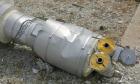 Used Doyle And Roth U Tube Heat Exchanger, approximately 10 square feet, vertical. 316L stainless steel shell rated FV/75 psi at 325 deg.f., (20) 3/4