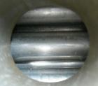 Used Doyle And Roth U Tube Heat Exchanger, approximately 10 square feet, vertical. 316L stainless steel shell rated FV/75 psi at 325 deg.f., (20) 3/4