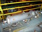 Used: Doyle and  Roth shell and tube heat exchanger, 98 square feet, vertical. Carbon steel shell rated 100 psi at 100 deg.f., (126) 3/4