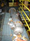 Used: Doyle and  Roth shell and tube heat exchanger, 98 square feet, vertical. Carbon steel shell rated 100 psi at 100 deg.f., (126) 3/4