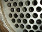 Used Doyle and Roth Shell and Tube Heat Exchanger, 98 square feet, vertical. Carbon steel shell rated 100 psi at 100 deg F, (126) 3/4