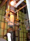 Used: Doyle and  Roth shell and tube heat exchanger, 98 square feet, vertical. Carbon steel shell rated 100 psi at 100 deg.f., (126) 3/4