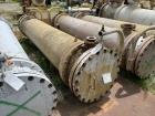 Used Doyle & Roth Shell & Tube Heat Exchanger, Horizontal. Approximate 1,115 Square Feet. Carbon steel shell rated 150 psi at -20 to 150 degrees F. (568) 304L Stainless steel 3/4