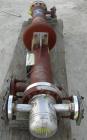 USED: Doyle and Roth multi-pass shell and tube heat exchanger, 18.8 square feet, vertical. Carbon steel shell with expansion ring rated 150 psi at 600 deg F. (16) 3/4