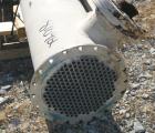 USED: Graham single pass shell and tube heat exchanger, 611 square feet, vertical. Carbon steel shell rated FV/20 psi at 150 deg F, (208) 3/4