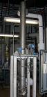 USED: ITT U-tube heat exchanger, approximately 51 square feet, vertical. 316L stainless steel shell rated 150 psi at 350 degrees F, 316L stainless steel head. (34) 3/8