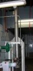 USED: ITT U-tube heat exchanger, approximately 51 square feet, vertical. 316L stainless steel shell rated 150 psi at 350 degrees F, 316L stainless steel head. (34) 3/8
