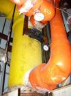 Used Manning And Lewis Shell And Tube Heat Exchanger, 557 square feet, vertical. Carbon steel shell rated 100 psi at 150 deg.f., (474) 3/4