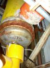 Used Manning And Lewis Shell And Tube Heat Exchanger, 557 square feet, vertical. Carbon steel shell rated 100 psi at 150 deg.f., (474) 3/4