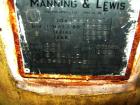 Used Manning And Lewis Shell And Tube Heat Exchanger, 557 square feet, vertical. Carbon steel shell rated 100 psi at 150 deg.f., (474) 3/4