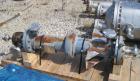 Used Pfaudler Single Pass Shell & Tube Heat Exchanger, 15.2 square feet, vertical. Carbon steel shell rated 100 psi at -20 to 400 deg F. (26) 3/4
