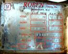 USED: Roben shell and tube heat exchanger, 36 sq ft, 304 stainless steel. 2 piece bolt together carbon steel shell rated 50 psi at 300 deg F, (40) 5/8