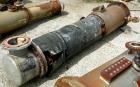 USED: Roben single pass shell and tube heat exchanger, 199 square feet, vertical. Carbon steel shell rated 100 psi at 212 deg F, (204) 3/4