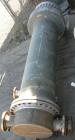 USED: Wayron Inc multi pass shell and tube heat exchanger, 706 square feet, horizontal. Carbon steel shell with expansion ring rated 150 psi at 370 deg F. (180) 1-1/4