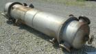 Used Wolfe Mechanical and Equipment Single Pass Shell and Tube Heat Exchanger, 1285 square feet, vertical. 304 Stainless steel shell rated 100 psi at 300 degrees F. (656) 3/4