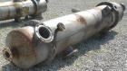 Used Wolfe Mechanical and Equipment Single Pass Shell and Tube Heat Exchanger, 1285 square feet, vertical. 304 Stainless steel shell rated 100 psi at 300 degrees F. (656) 3/4