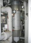 Used 318 square foot Ketema shell and tube heat exchanger. 316L stainless steel tubes, tube sheets and bonnets with (432) 5/8