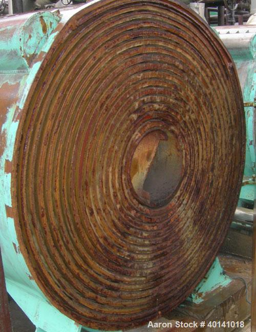 Used: American Heat Reclaim spiral heat exchanger, 1,690 square feet, type 1-H, carbon steel heads.  Internal: carbon steel, rated 100 psi @ 200 deg F/ -20 deg F @ 150 psi. Year 1977, serial #12105, ...